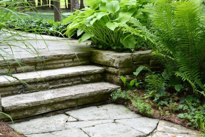 Hand-hewn stone garden pathway, stairs / steps, retaining wall and deck.