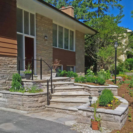 Hand-hewn lime stone steps, retaining walls, planters and landing.