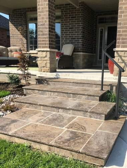 Stone front steps and landing in square Eramosa Flurry cut stone from Owen Sound installed over concrete. This product is beautiful and in demand world wide. Ilderton, Ontario.