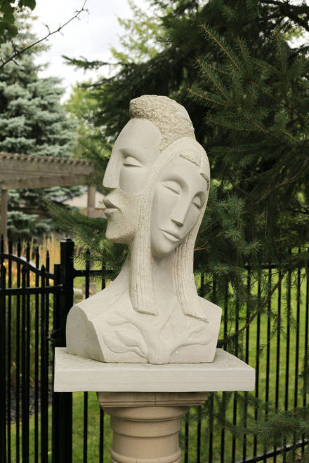 Garden art. Stone sculpture in its backyard setting. Daphne & Apollo. Limestone.