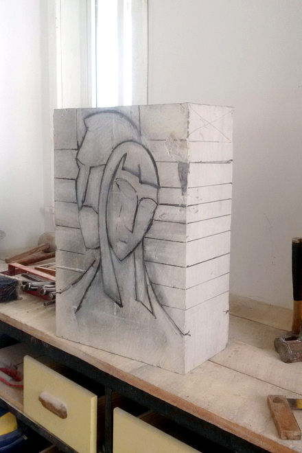 Daphne and Apollo in the studio. Stage one - drawing sketched on the stone block.
