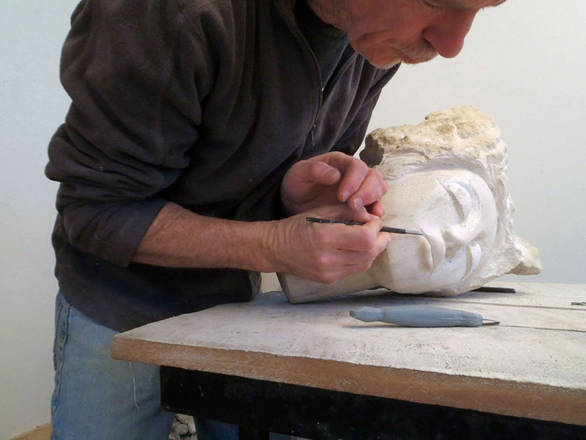 Chris hand carving limestone.