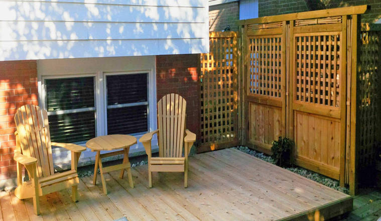 Custom woodwork project: wood trellis, screen, and deck.
