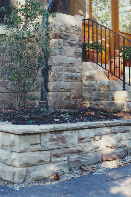Hand-hewn stone retaining wall. A hard landscaping project.