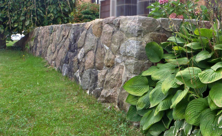 Hand-hewn granite / stone retaining wall and deck / patio.