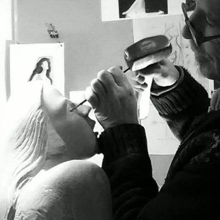 Chris hand carving limestone.