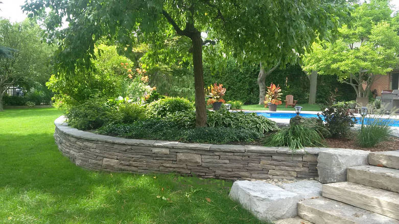 Hand-hewn stone retaining wall.